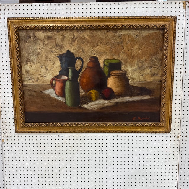 A captivating mid-century Italian still life oil painting on canvas, signed E. Romini in the lower right corner. Featuring...