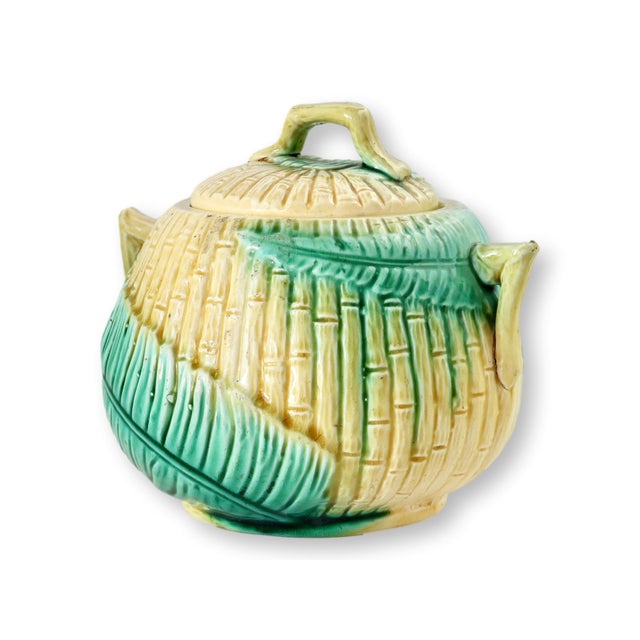 English majolica covered sugar bowl featuring a charming bamboo and fern motif in classic green and yellow glaze. The...