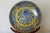 Striking 20th century Chinese porcelain charger featuring an intricate cobalt blue dragon motif set against a vibrant...