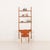 The danish home office teak shelving unit with a desk is reminiscent of the iconic 1960s modular furniture designed by...
