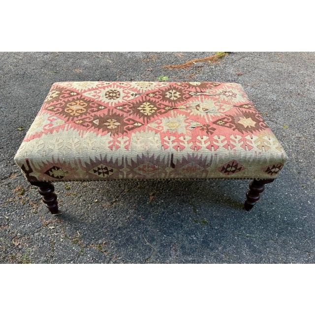 George Smith Standard Ottoman in kilim on turned mahogany legs.