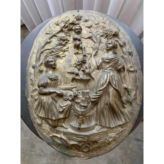 Here we have an antique French gilt bronze oval wall plaque. Most likely salvaged from a wedding armoire and absolutely...