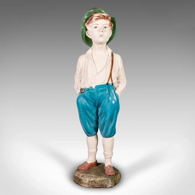 This is a tall vintage whistling boy figure. An English, plasterwork decorative display statue, dating to the Art Deco...