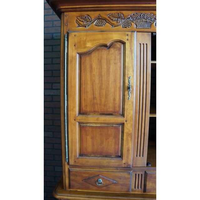 Country French charm and abundant storage come together in this armoire from Hickory Chair. Finely crafted of Cherry with...