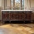 Antique Directoire Style French Mahogany Buffet with Carrara Marble Top is a striking and elegantly proportioned piece,...