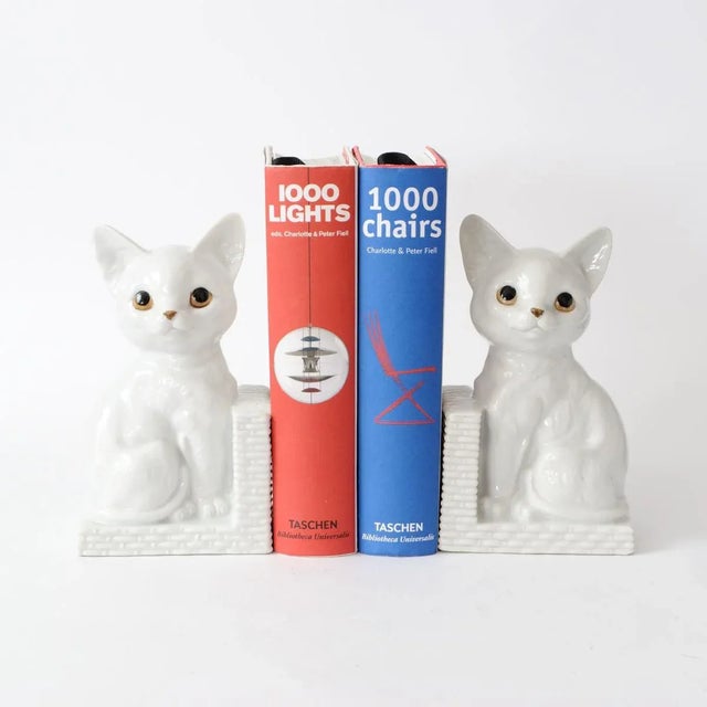 Pair of white porcelain cat bookends. Unsigned, but made probably in Japan for Dutch market.