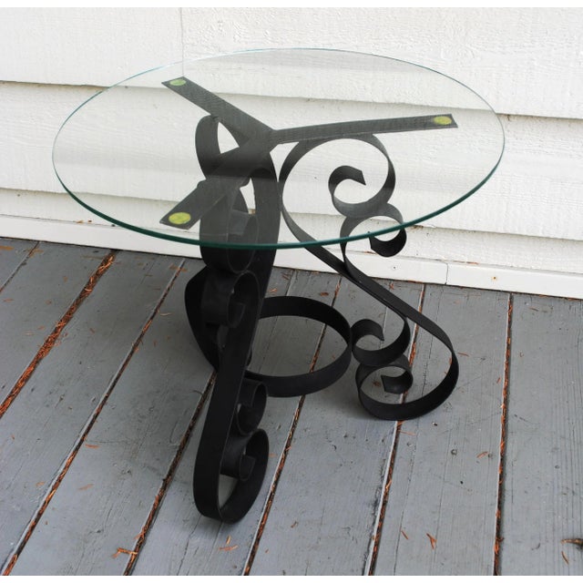 Vintage wrought iron scroll accent table. It currently has a 19" diameter glass top, but could go as small as a 15"...