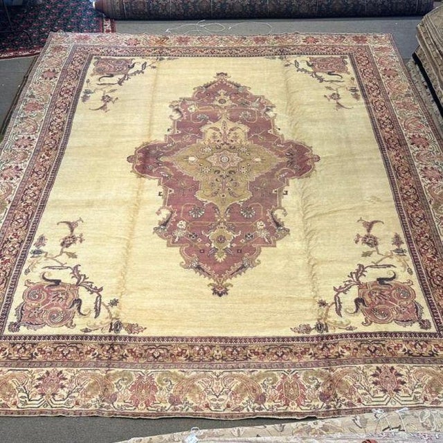 An Antique Agra Rug Defined by Quiet Luxury This exceptional antique Agra rug, handwoven approximately 100 years ago, is a...