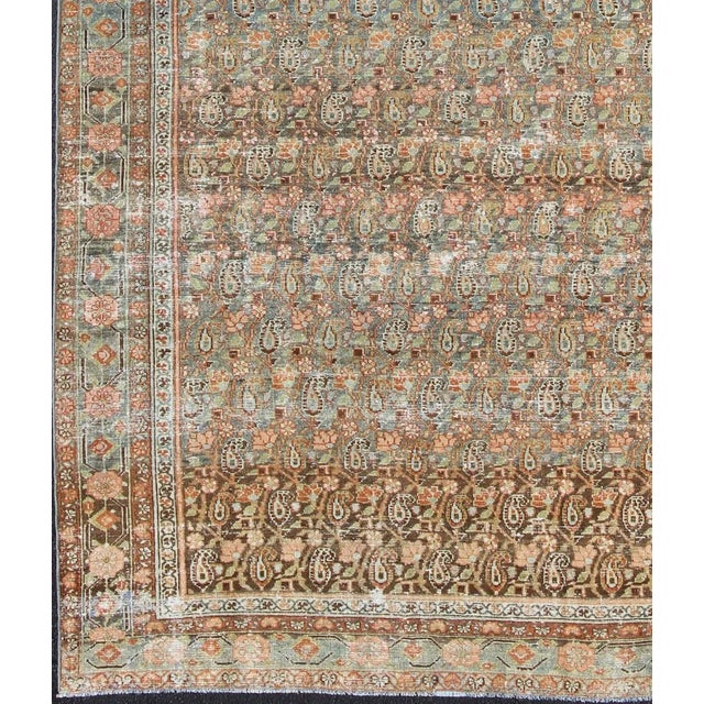Measures: 6'8 x 13'4. Antique Persian Malayer Rug with Allover Paisley Motifs in Warm Colorful Tones. Keivan Woven Arts /...