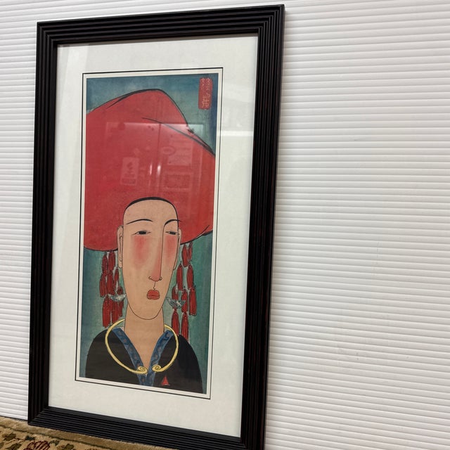 Design Plus Gallery presents a Watercolor Print by Vu Thu Hien. The print depicts a female figure in a large hat and rich...