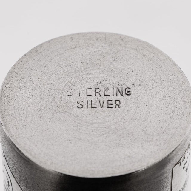 A novelty solid silver canadian club whisky bottle. Of a miniature size however heavy gauge throughout. A cylindrical form...