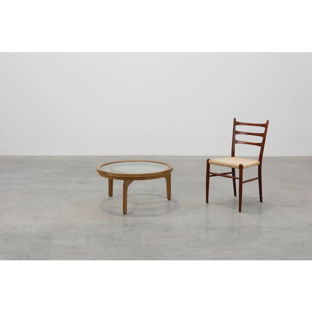 A refined modern table from late‑20th‑century Italy, combining the warmth of natural cedar wood with the clarity and...