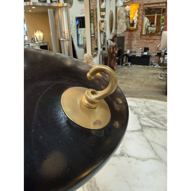 Elegant Italian mid-century modern adjustable desk lamp in the style of Stilnovo, featuring a sculptural dual-shade design...