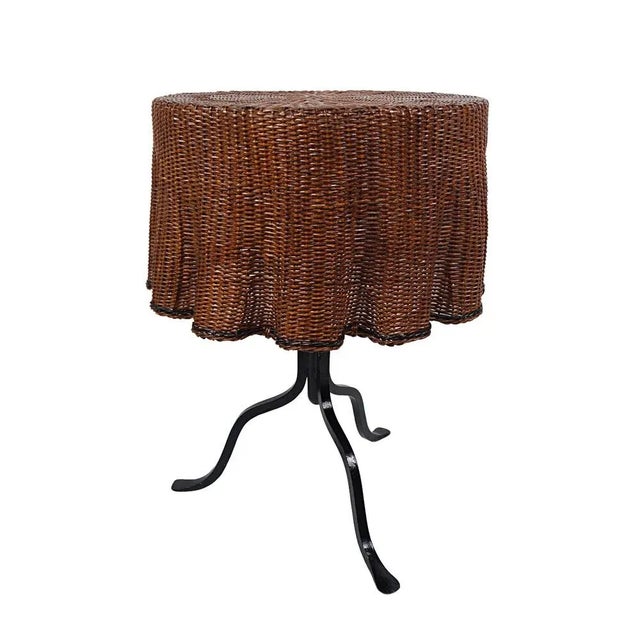 Rare iron cast coffee table with rattan top in the shape of a table cloth dating from the first half of the last century....