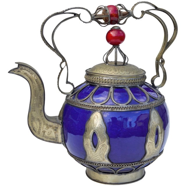 Vintage handcrafted and glazed blue ceramic kettle. Features an intricately hand-engraved Moorish pattern with ornate...