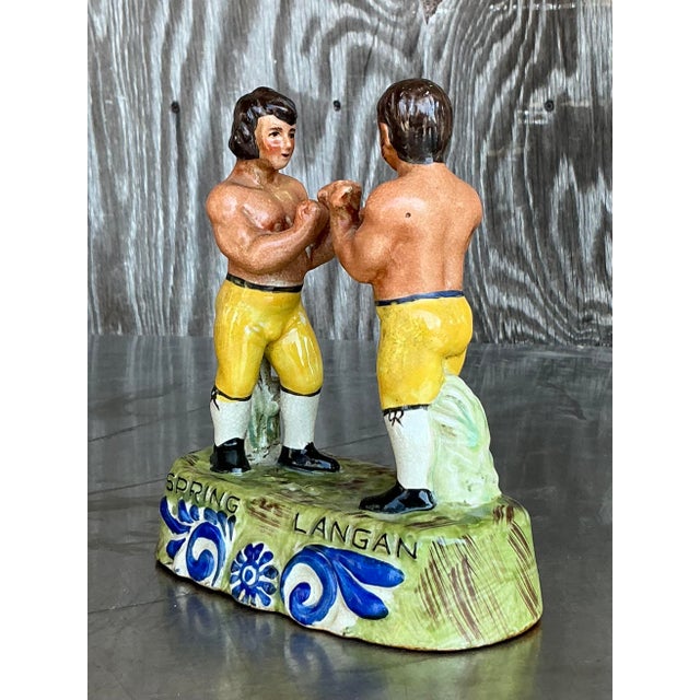 Step back into the spirited world of 19th-century pugilism with this charming Vintage Boho Staffordshire Boxing Figurine....