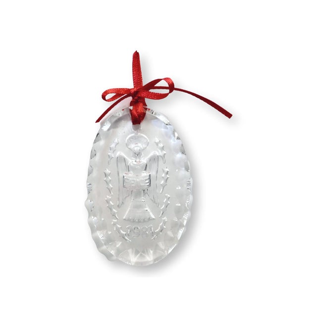 A lovely vintage pair of Waterford crystal ornaments dated 1981, each showcasing the star-topped Christmas tree motif that...