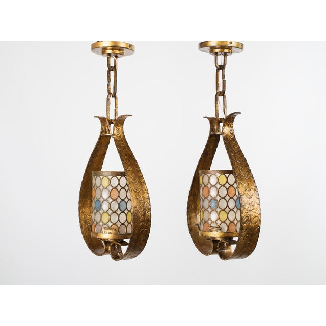 Elevate your space with this rare and captivating pair of mid-century lantern pendant lights, handcrafted in Spain circa...