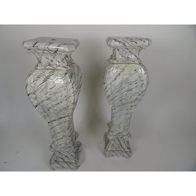 Extremely rare Swedish style pair of mid-20th century tromp l'oeil painted ceramic pedestals. Painted in the manner of...