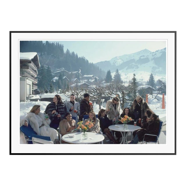 Drinks at Gstaad 1984 by Slim Aarons Framed C-Print For Sale