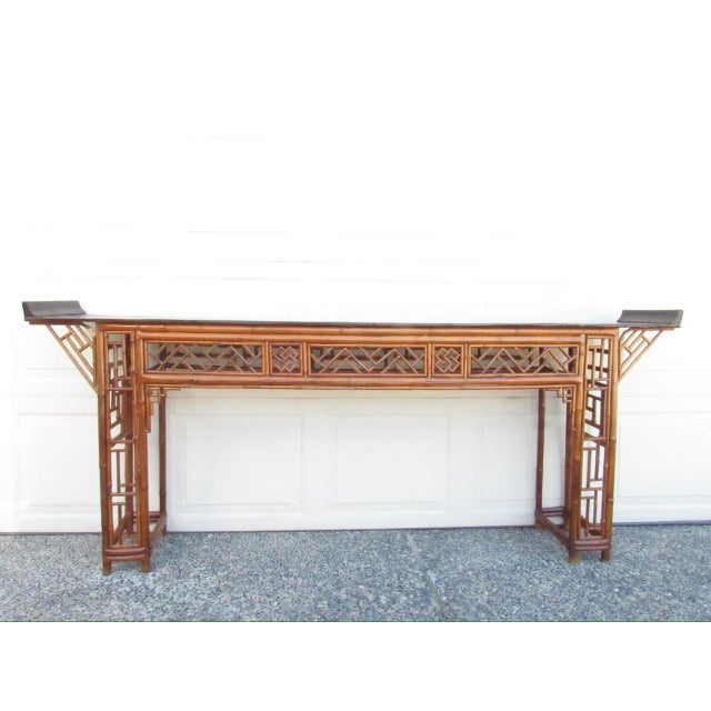 Chinese Chippendale style bamboo altar or console table, c.1940’s Having a slender elongated shape, it features a black...