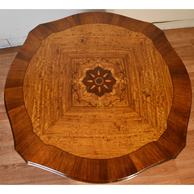 We are pleased to offer this beautiful Antique French Louis XV center table, from the 1910s. This table is made of Walnut...