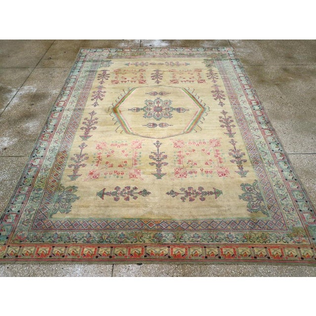 This exquisite early 20th-century Indian Agra rug, beautifully reflects the refined artistry and craftsmanship of...