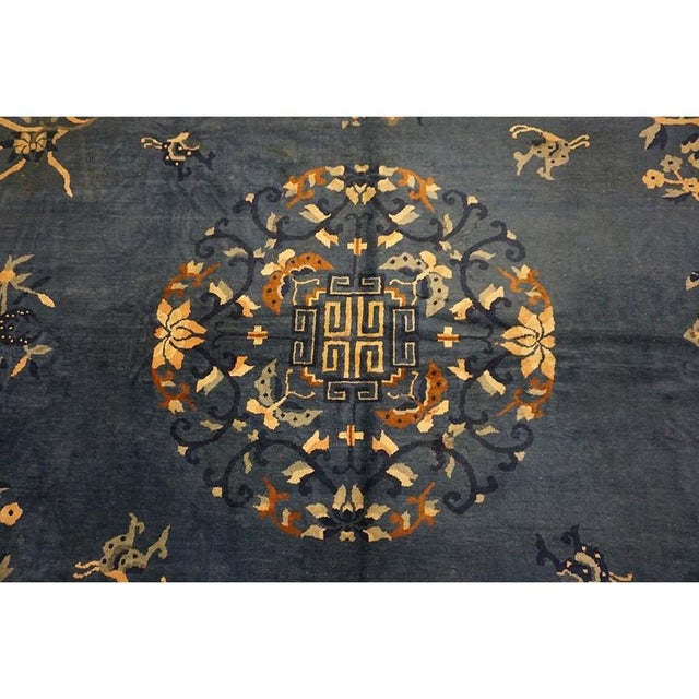 "This is a magnificent and highly authentic oversized antique Chinese Peking rug, . Hand-knotted circa 1920, this grand...