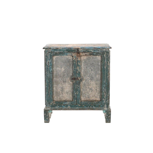 This Antique Indian Painted Food Cabinet is a charming storage piece handcrafted from solid teakwood and finished in...