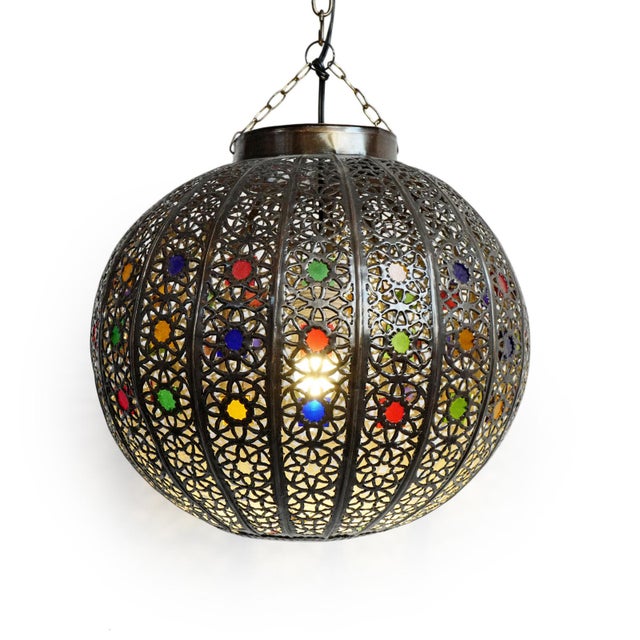 Beautifully aged vintage Moroccan pendant light crafted in warm-toned bronze, featuring an intricate hand-pierced filigree...