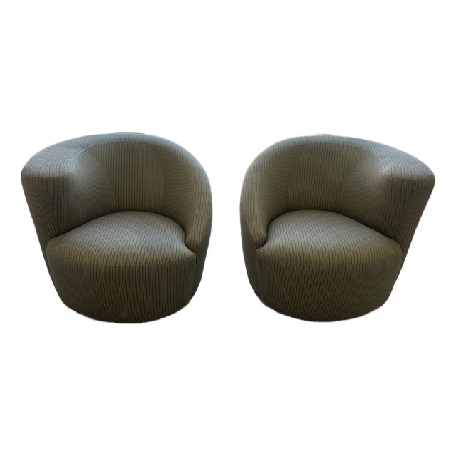 This pair of swiveling “Nautilus” chairs by Vladimir Kagan, crafted in America circa 1970, is a quintessential example of...