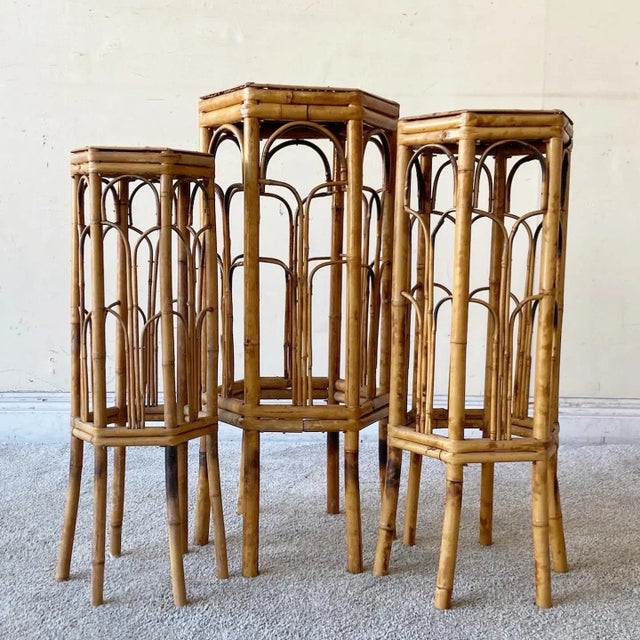 Incredible set of three vintage boho chic nesting tables. Each table is constructed of a tortoise shell bamboo. Medium...