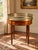A handsome French Louis XVI–style bouillotte table in mahogany dating to the 19th century, retaining its original grey...