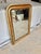 Found in Provence, this 19th Century French Louis Philippe Giltwood Wall Mirror was crafted in the late 1800's. The piece...