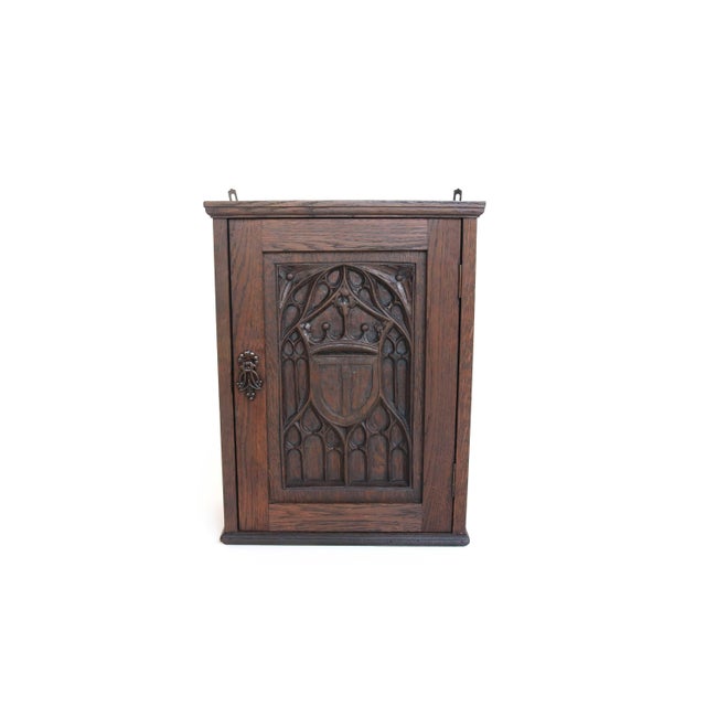 This beautifully crafted late 19th-century French Neo-Gothic wall cabinet is a striking example of traditional Gothic...