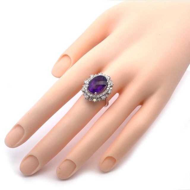 This is a gorgeous cocktail ring, it is crafted from 14k white gold featuring appx 6 to 8 carats oval amethyst gemstone...