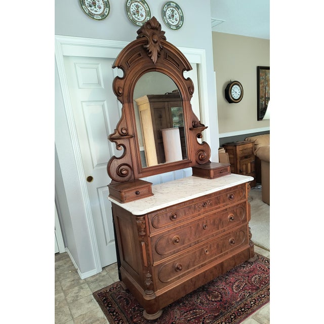 Mahogany bedroom dresser/chest with tall mirror and marble top, ca 1855. Carved car-touche and volute supports for mirror....