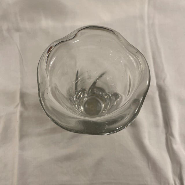 A Fine French Daum crystal vase with body with swirled is on and top profile, looking like a five petaled flower. Daum...