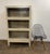 A handsome set of three vintage industrial barrister bookcases or display cabinets constructed of steel with large glass-...