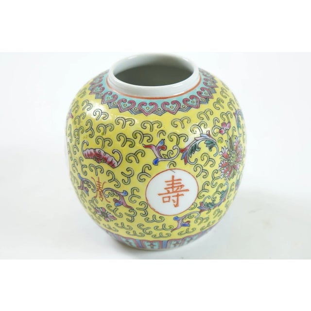 This Early 20th Century Chinese Porcelain Jar features a vibrant and intricate design that draws the eye immediately. The...