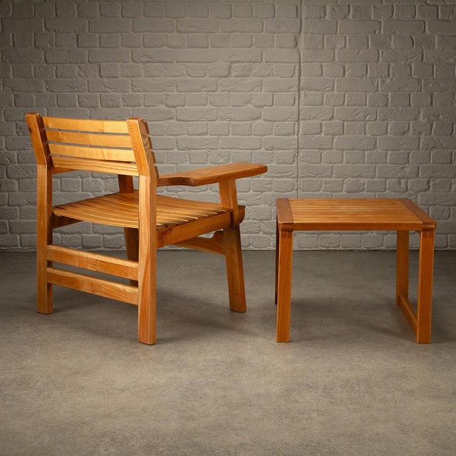 A highly unusual scratch-made armchair and side table in solid oak from denmark. The chair takes many design cues from...