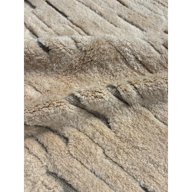 introcuct your home decor with this exquisite Modern Moroccan Beni Ourain Wool Rug, a blend of traditional craftsmanship...