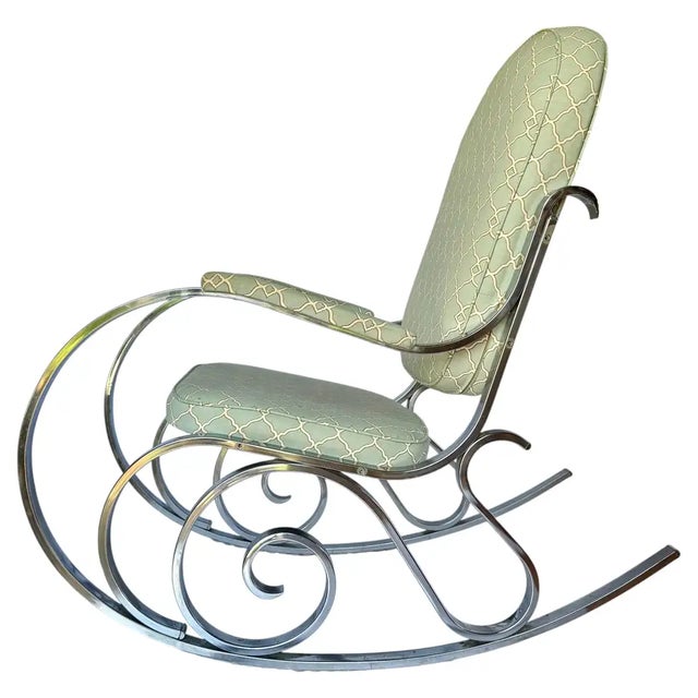 Elevate your interior with this breathtaking French Mid-Century Modern rocking armchair, featuring a mesmerizing, ornate...