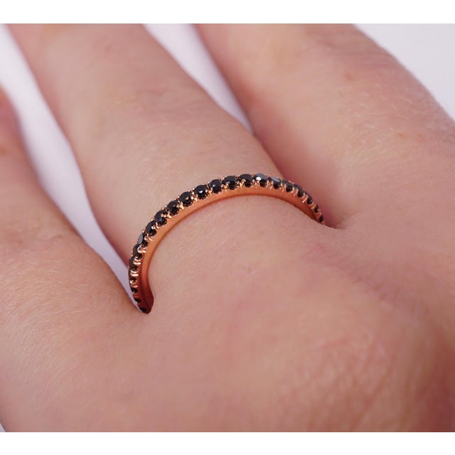 Black Diamond eternity wedding band set in 14K Rose gold. Pave set brilliant round diamonds are natural black. Carat...