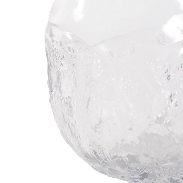 The Portage Vase stands out with its unique abstract shape and textured design, bringing a modern, artistic touch to any...