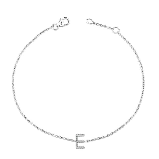 Immerse yourself in the understated elegance of this 10K white gold bracelet, rhodium-plated for an enrapturing shimmer...