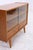 Vintage 1960s chest of drawers with clean lines and beautiful veneer grain. The combination of a glazed display area and...