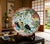 This magnificent antique hand made Japanese porcelain charger features intricate hand-painted artwork depicting...