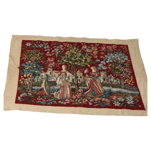 An antique needlepoint tapestry, dating to the 19th century, presents a captivating Louis XIII style scenic pictorial....