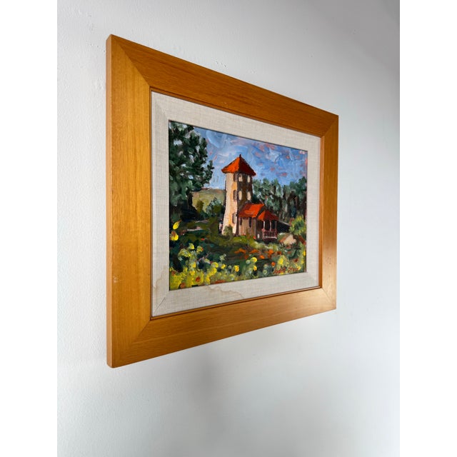 This vibrant vintage oil on canvas by Judith Stern features a picturesque countryside scene rendered in a rich...